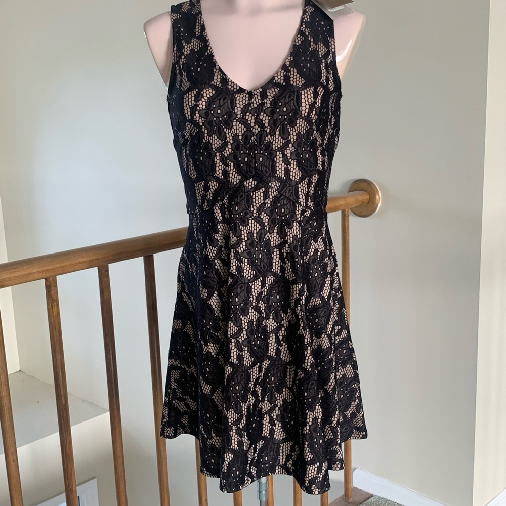 New with tag stretch nude with black lace.
